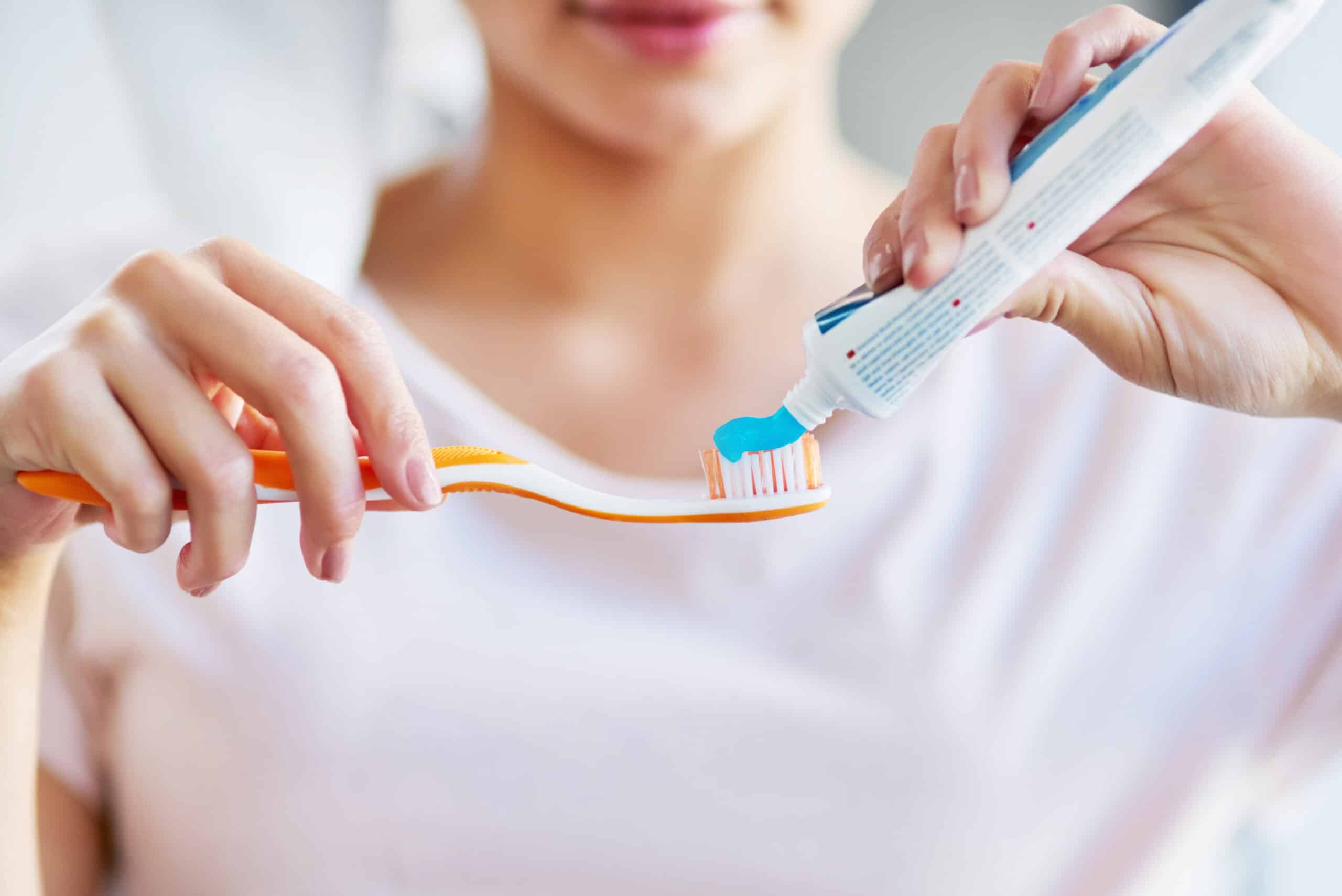 Woman holding a toothbrush