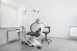 Common Causes of Tooth Pain and When to See a Dentist 1 - Olathe Dentist | Your Olathe Dentist Tooth pain is one of the most common dental complaints affecting people of all ages. It can range from a mild, occasional ache to severe, persistent pain that interferes with eating, sleeping, and daily activities. While some cases of tooth pain may resolve on their own, many indicate an underlying dental problem that requires professional attention. Ignoring tooth pain can lead to worsening conditions, more extensive treatments, and even permanent tooth loss. Understanding the common causes of tooth pain and recognizing when it's time to see a dentist can help you protect your oral health and avoid unnecessary complications. In this article, we'll explore the most frequent reasons behind tooth pain, how to identify the symptoms, and when professional dental care is essential. What Causes Tooth Pain? Tooth pain can originate from various dental issues, including damage to the tooth, infection, gum disease, or even problems outside the mouth. Identifying the source of the pain is the first step toward effective treatment. 1. Tooth Decay (Cavities) One of the leading causes of tooth pain is tooth decay. Cavities develop when bacteria in the mouth produce acids that erode the tooth's protective enamel. As the decay progresses deeper into the tooth, it can reach the sensitive inner layers, causing pain and sensitivity. Common symptoms include: Pain when eating sweets Sensitivity to hot, cold, or sugary foods Visible holes or dark spots on the tooth Persistent toothache Early cavities can often be treated with a simple filling. However, advanced decay may require root canal therapy or even tooth extraction if left untreated. 2. Tooth Infection (Dental Abscess) A dental abscess is a serious infection that develops when bacteria enter the tooth's pulp or surrounding tissues. This condition often causes severe, throbbing pain and requires immediate dental care. Symptoms may include: Intense, constant toothache Swelling in the gums or face Bad taste in the mouth Fever Sensitivity when chewing Ignoring a dental abscess can allow the infection to spread to other parts of the body, making prompt treatment essential. 3. Gum Disease Healthy gums are essential for strong teeth. Gum disease begins with gingivitis and can progress into periodontitis if left untreated. As the gums become inflamed and infected, they may pull away from the teeth, exposing sensitive tooth roots. Signs of gum disease include: Red, swollen gums Bleeding while brushing or flossing Persistent bad breath Loose teeth Tooth sensitivity Professional cleanings and improved oral hygiene can often reverse early gum disease, while advanced cases may require specialized periodontal treatment. 4. Tooth Sensitivity Some people experience sharp pain when consuming hot, cold, sweet, or acidic foods. Tooth sensitivity often occurs when the protective enamel wears down or the gums recede, exposing the dentin underneath. Common causes include: Aggressive brushing Worn enamel Gum recession Teeth grinding Acidic foods and beverages Using toothpaste designed for sensitive teeth may provide relief, but persistent sensitivity should be evaluated by a dentist to identify the underlying cause. 5. Cracked or Broken Tooth A cracked tooth can cause pain when biting down or releasing pressure. Cracks may result from: Biting hard foods Sports injuries Falls or accidents Teeth grinding Some cracks are difficult to detect because they may not be visible on the surface. Depending on the severity, treatment may involve bonding, crowns, root canal therapy, or extraction. 6. Worn Dental Fillings or Crowns Dental restorations such as fillings and crowns don't last forever. Over time, they can become loose, crack, or wear down, allowing bacteria to enter and cause pain. Warning signs include: Pain while chewing Sensitivity near an old filling Sharp edges on a filling Food getting trapped around the restoration Replacing damaged restorations can protect the tooth from further decay and discomfort. 7. Impacted Wisdom Teeth Wisdom teeth often don't have enough room to erupt properly. When they become impacted, they may press against neighboring teeth or become partially trapped beneath the gums. Symptoms include: Pain in the back of the mouth Jaw stiffness Swollen gums Difficulty opening the mouth Bad breath Dentists commonly recommend wisdom tooth removal when impacted teeth cause pain or increase the risk of infection. 8. Teeth Grinding (Bruxism) Many people grind or clench their teeth during sleep without realizing it. Over time, this habit places excessive pressure on the teeth and jaw. Symptoms include: Morning jaw pain Tooth sensitivity Worn tooth surfaces Headaches Chipped teeth A custom night guard can help protect the teeth while reducing pressure on the jaw. 9. Sinus Infections Sometimes tooth pain isn't actually caused by a dental problem. The roots of the upper back teeth are located close to the sinus cavities. When the sinuses become inflamed, pressure can create pain that feels like a toothache. Signs of sinus-related tooth pain include: Pressure behind the cheeks Nasal congestion Facial pain Pain affecting multiple upper teeth If symptoms occur alongside cold or sinus infection symptoms, a medical evaluation may be appropriate. 10. Food Trapped Between Teeth Something as simple as food lodged between teeth can cause irritation, pressure, and pain. Removing trapped food with dental floss usually resolves the discomfort. However, if pain continues, there may be an underlying cavity or gum problem that requires attention. Home Remedies for Temporary Tooth Pain Relief While home remedies cannot treat the underlying cause of tooth pain, they may provide temporary relief until you can see a dentist. Some helpful measures include: Rinsing with warm salt water Applying a cold compress to reduce swelling Taking over-the-counter pain relievers as directed Using sensitive toothpaste Avoiding extremely hot, cold, or sugary foods Keeping the affected area clean Avoid placing aspirin directly on the gums, as this can damage soft tissues. When Should You See a Dentist? Not every minor toothache is a dental emergency, but certain symptoms should never be ignored. Schedule a dental appointment if you experience: Tooth pain lasting longer than one or two days Persistent sensitivity Pain while chewing Swollen or bleeding gums A chipped or cracked tooth Loose teeth Bad breath that doesn't improve Visible holes or discoloration in a tooth Early treatment usually means simpler, less expensive procedures and better long-term outcomes. Dental Emergencies That Require Immediate Care Certain situations require urgent dental attention. Seek emergency dental care if you experience: Severe, unbearable tooth pain Swelling in the face or jaw Fever with tooth pain Difficulty swallowing or breathing Heavy bleeding after a dental injury Knocked-out permanent tooth Large fracture exposing the tooth's inner layers Prompt treatment may save the tooth and prevent serious complications. How Dentists Diagnose Tooth Pain During your appointment, the dentist will examine your mouth to determine the cause of the pain. The evaluation may include: Visual examination Dental X-rays Percussion testing (tapping on teeth) Bite evaluation Gum measurements Temperature sensitivity tests An accurate diagnosis ensures the most appropriate treatment plan. Treatment Options for Tooth Pain The right treatment depends on the underlying cause. Possible treatments include: Dental fillings for cavities Root canal therapy for infected teeth Dental crowns for cracked or weakened teeth Professional cleaning for gum disease Antibiotics for infections Tooth extraction when a tooth cannot be saved Night guards for teeth grinding Desensitizing treatments for sensitive teeth Your dentist will recommend the best option based on your condition. Preventing Tooth Pain Good oral hygiene is the best defense against many causes of tooth pain. Protect your teeth by: Brushing twice daily with fluoride toothpaste Flossing every day Limiting sugary snacks and beverages Drinking plenty of water Wearing a mouthguard during sports Using a night guard if you grind your teeth Visiting your dentist for regular cleanings and exams Replacing worn toothbrushes every three to four months Preventive care helps detect problems before they become painful or expensive to treat. Final Thoughts Tooth pain is your body's way of signaling that something needs attention. Whether it's a small cavity, gum disease, a cracked tooth, or an infection, addressing the problem early can prevent more serious complications and preserve your oral health. While temporary home remedies may help relieve discomfort, they should never replace professional dental care. If your tooth pain is persistent, severe, or accompanied by swelling or fever, don't delay seeking treatment. A timely visit to your dentist can provide lasting relief, protect your smile, and help you maintain healthy teeth for years to come. Remember, regular dental checkups, consistent oral hygiene habits, and early intervention remain the most effective ways to prevent tooth pain and enjoy a healthy, confident smile.